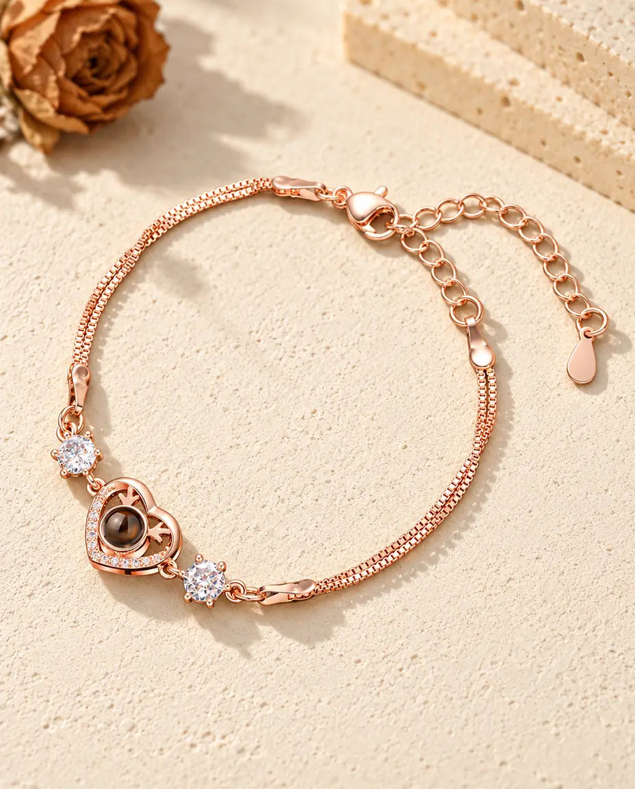 Roségoldfarbenes Herz-Armband mit Geweih, funkelnden Seitensteinen und doppelter Venezianerkette