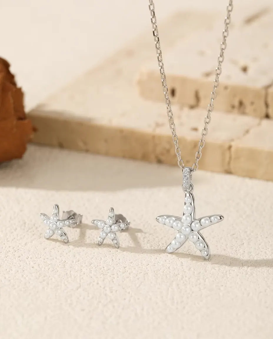 Seestern Schmuckset aus 925 Sterlingsilber - das ganze Set auf hellem Stein